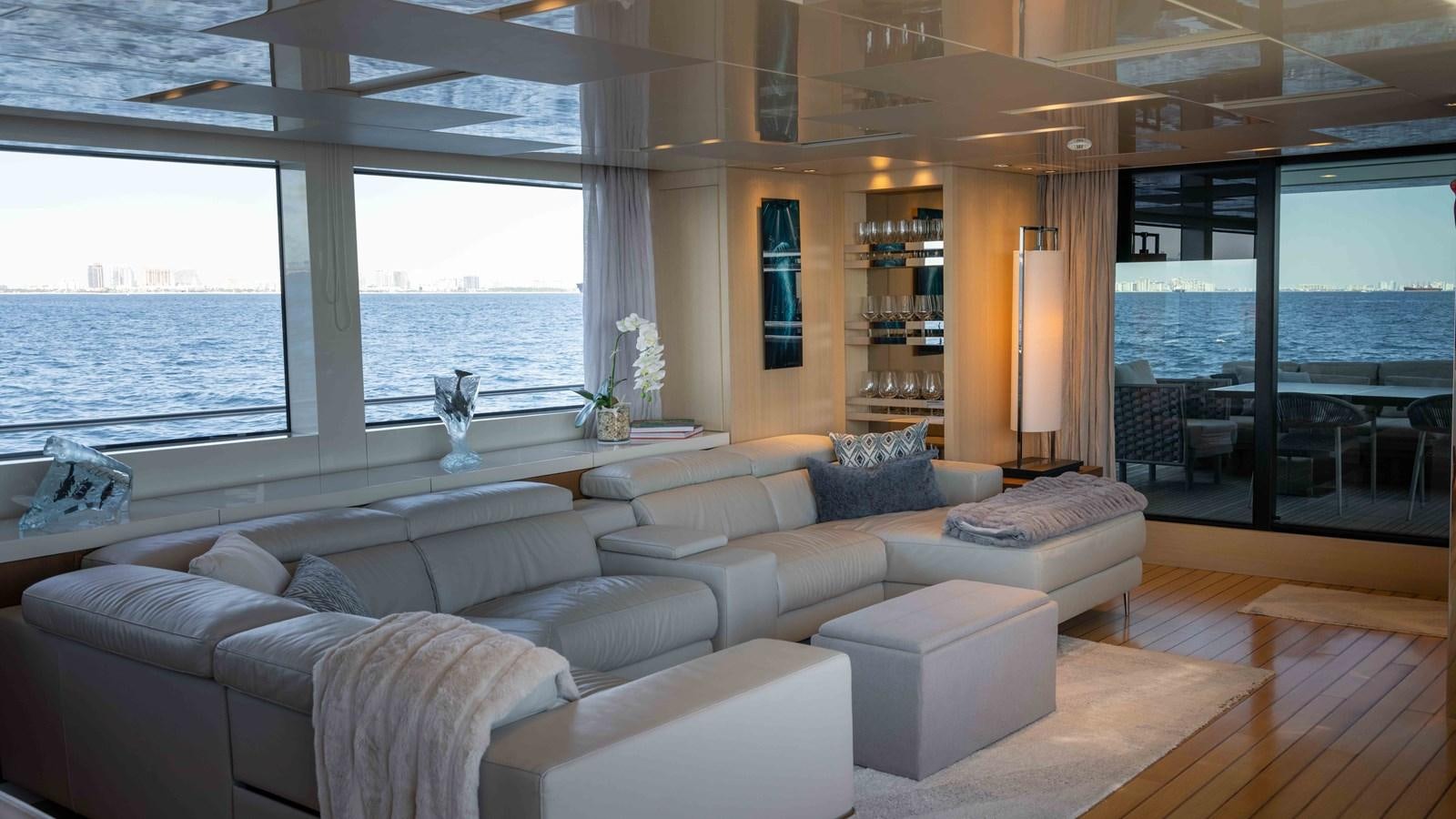 a living room with a large window aboard 106 FLYBRIDGE Yacht for Sale