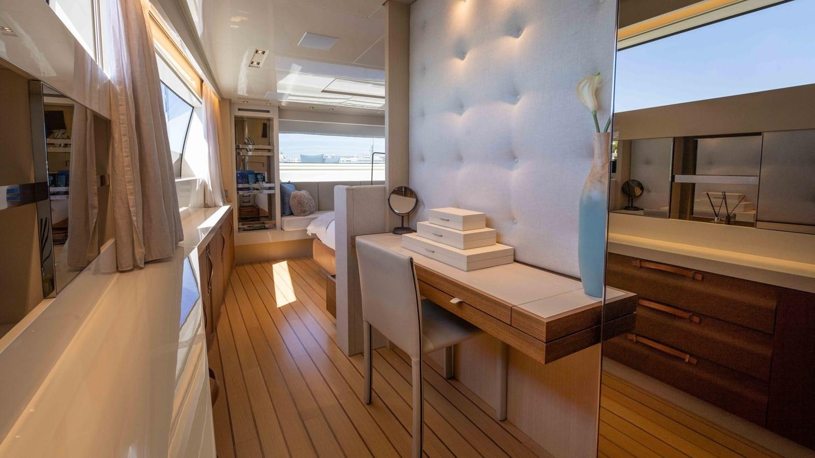 a room with a table and chairs aboard 106 FLYBRIDGE Yacht for Sale