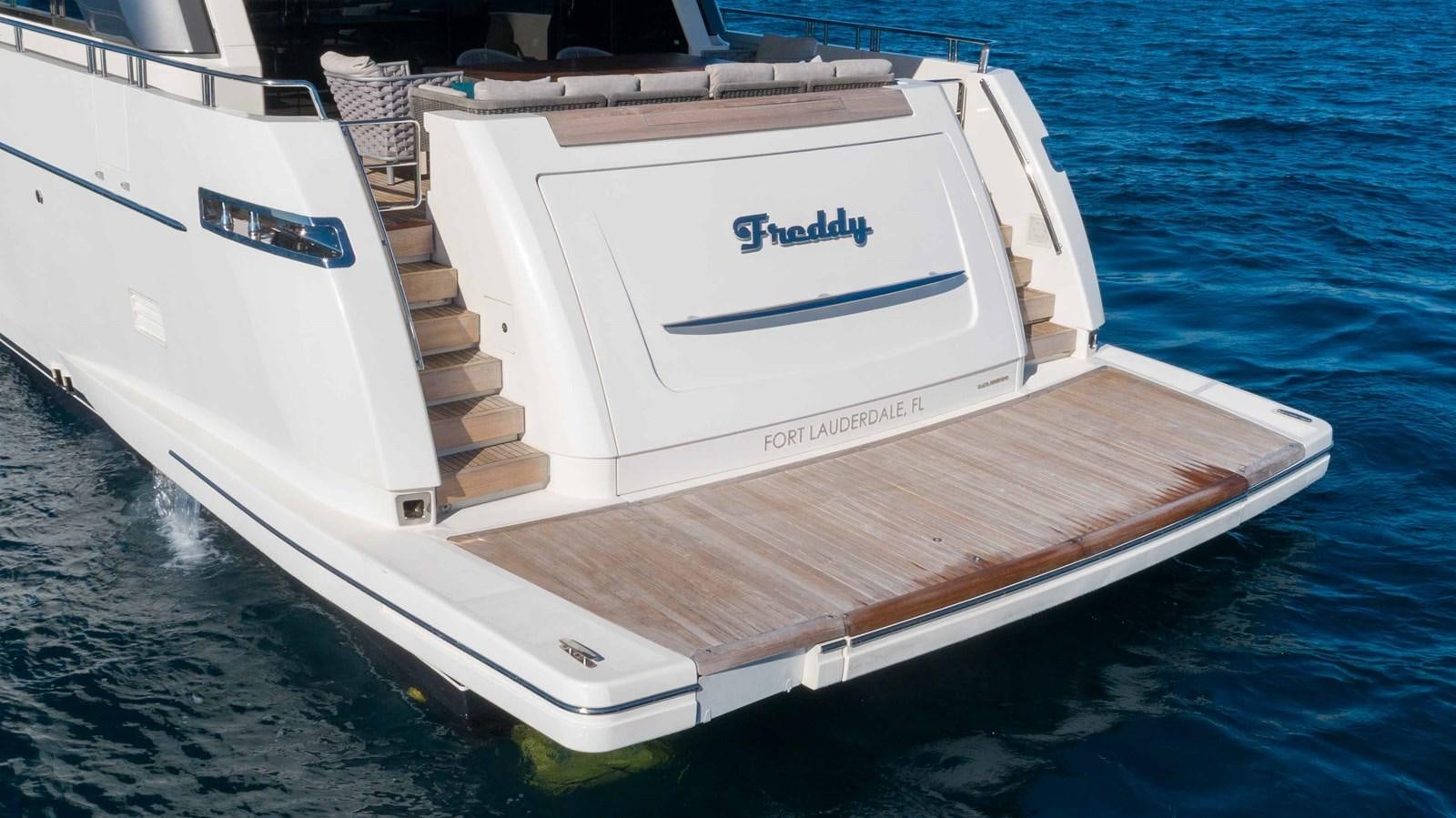a white boat in the water aboard 106 FLYBRIDGE Yacht for Sale