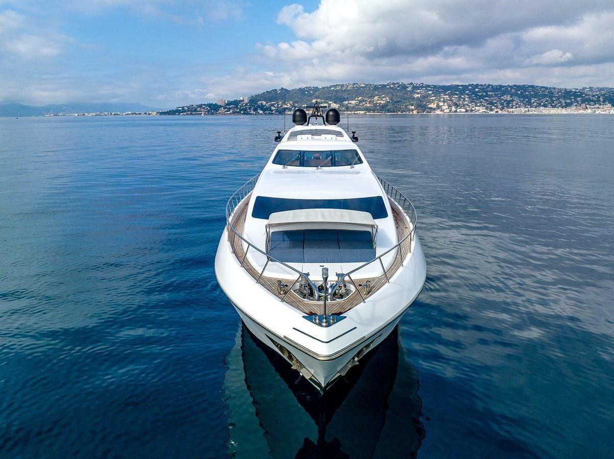 a white boat in the water aboard STORM Yacht for Sale