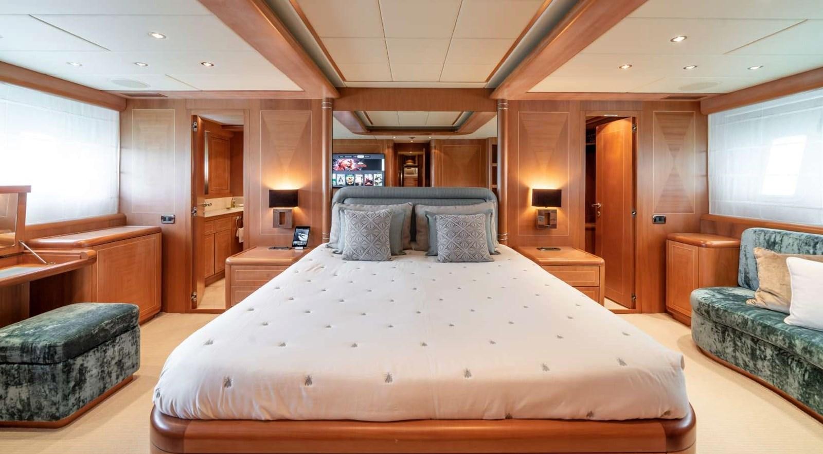 a large bed in a room aboard STORM Yacht for Sale