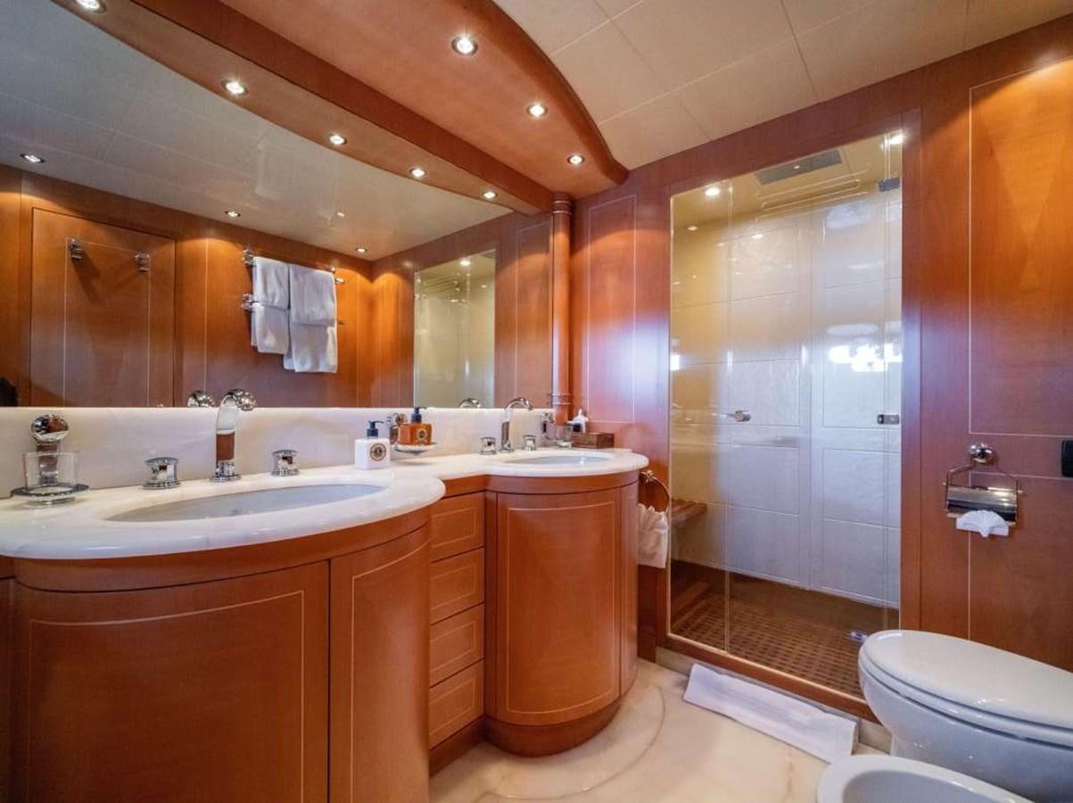 a bathroom with a large mirror aboard STORM Yacht for Sale