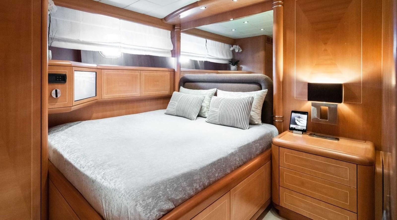 a bed with a white sheet aboard STORM Yacht for Sale