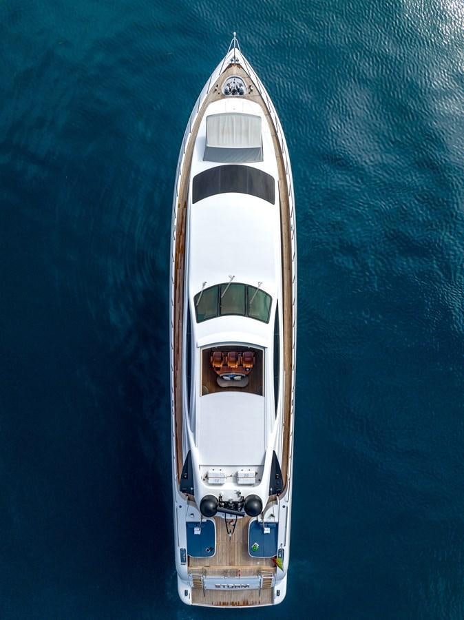 a white and gold boat aboard STORM Yacht for Sale