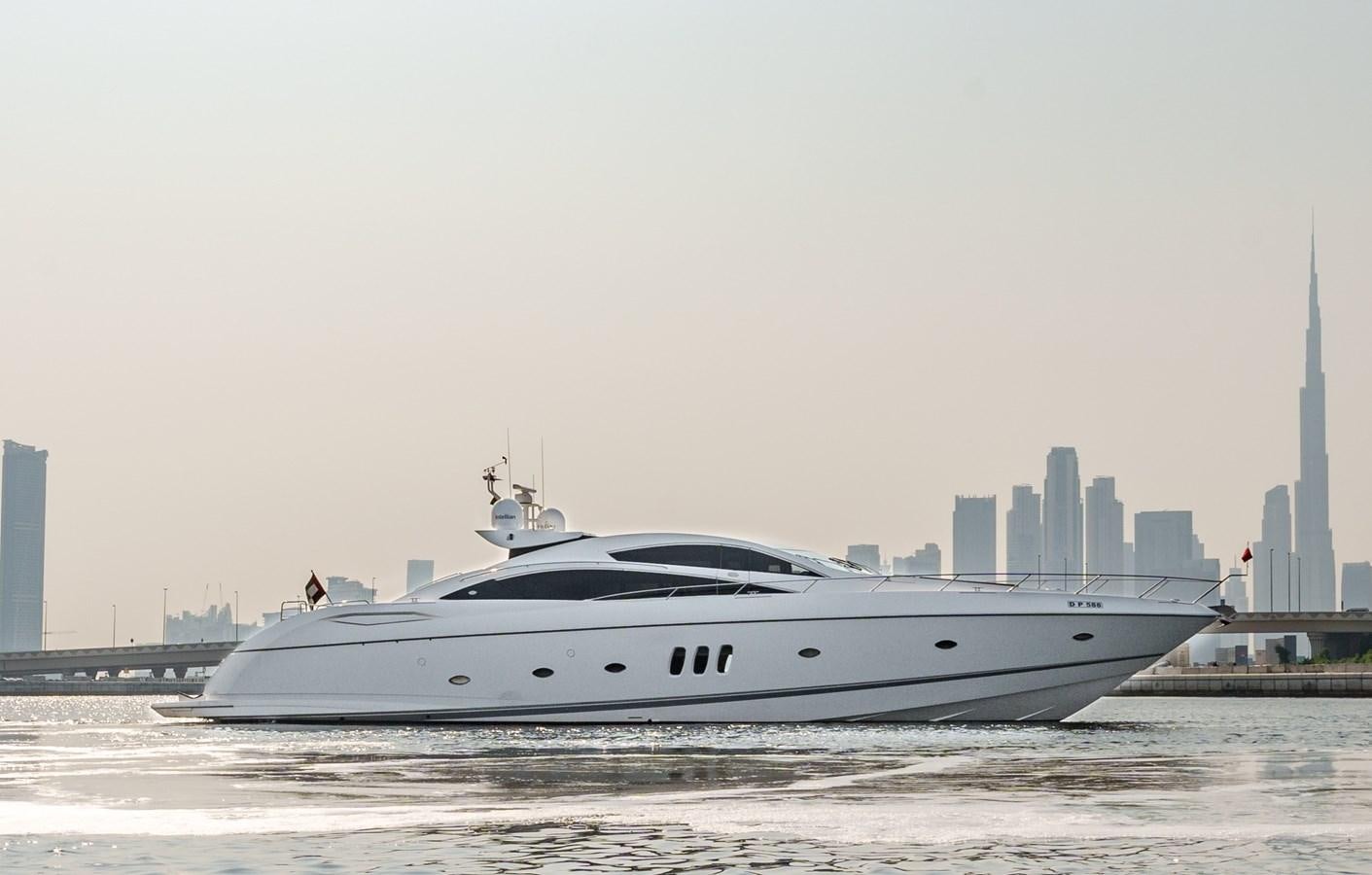 a white yacht on the water aboard MILA DUBAI Yacht for Sale