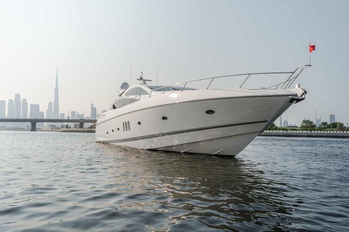 a white yacht on the water aboard MILA DUBAI Yacht for Sale