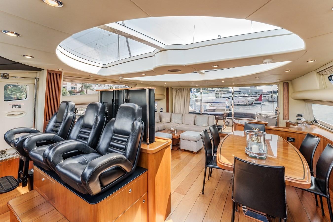 a living room with leather couches aboard MILA DUBAI Yacht for Sale