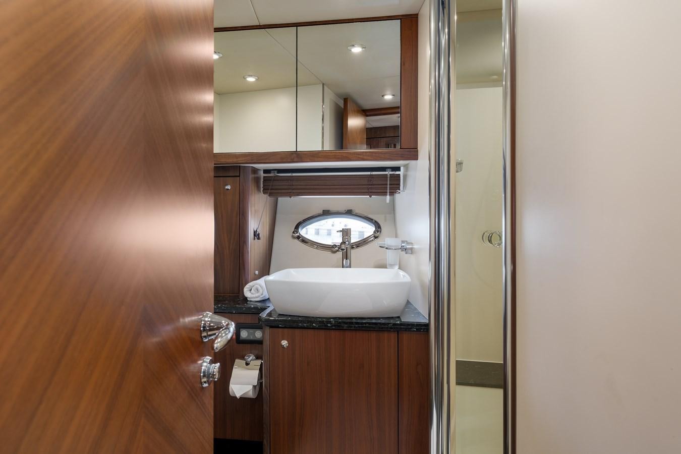 a bathroom with a sink and a mirror aboard MILA DUBAI Yacht for Sale
