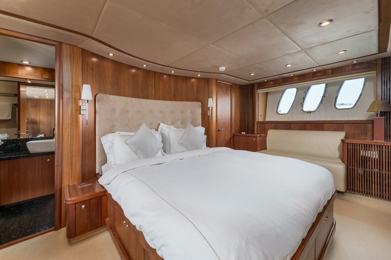 a large bed in a room aboard MILA DUBAI Yacht for Sale