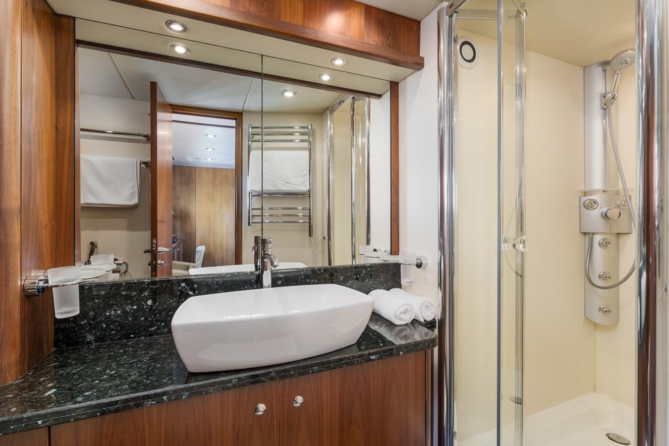 a bathroom with a sink and a mirror aboard MILA DUBAI Yacht for Sale
