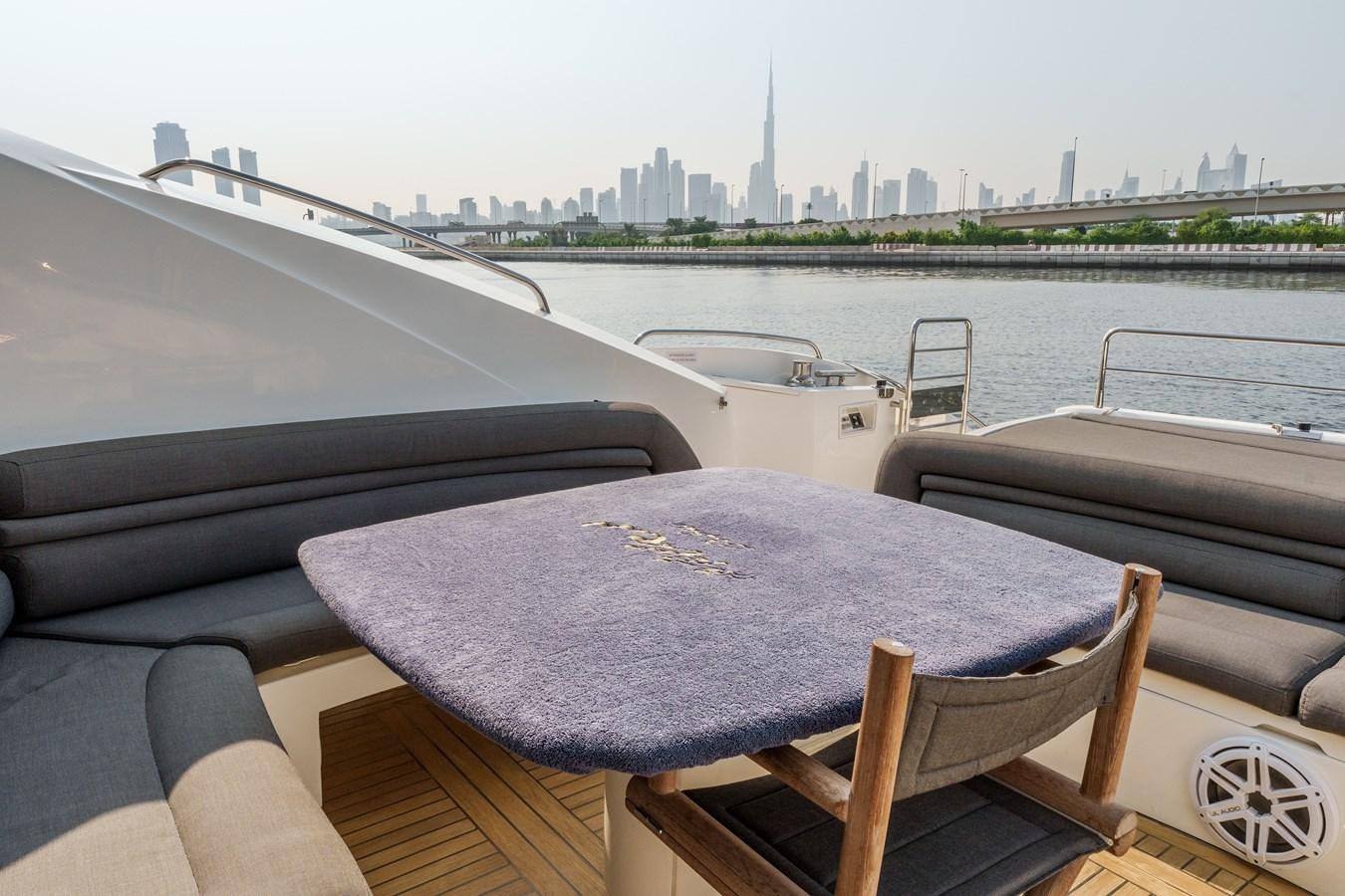 a boat on a deck aboard MILA DUBAI Yacht for Sale