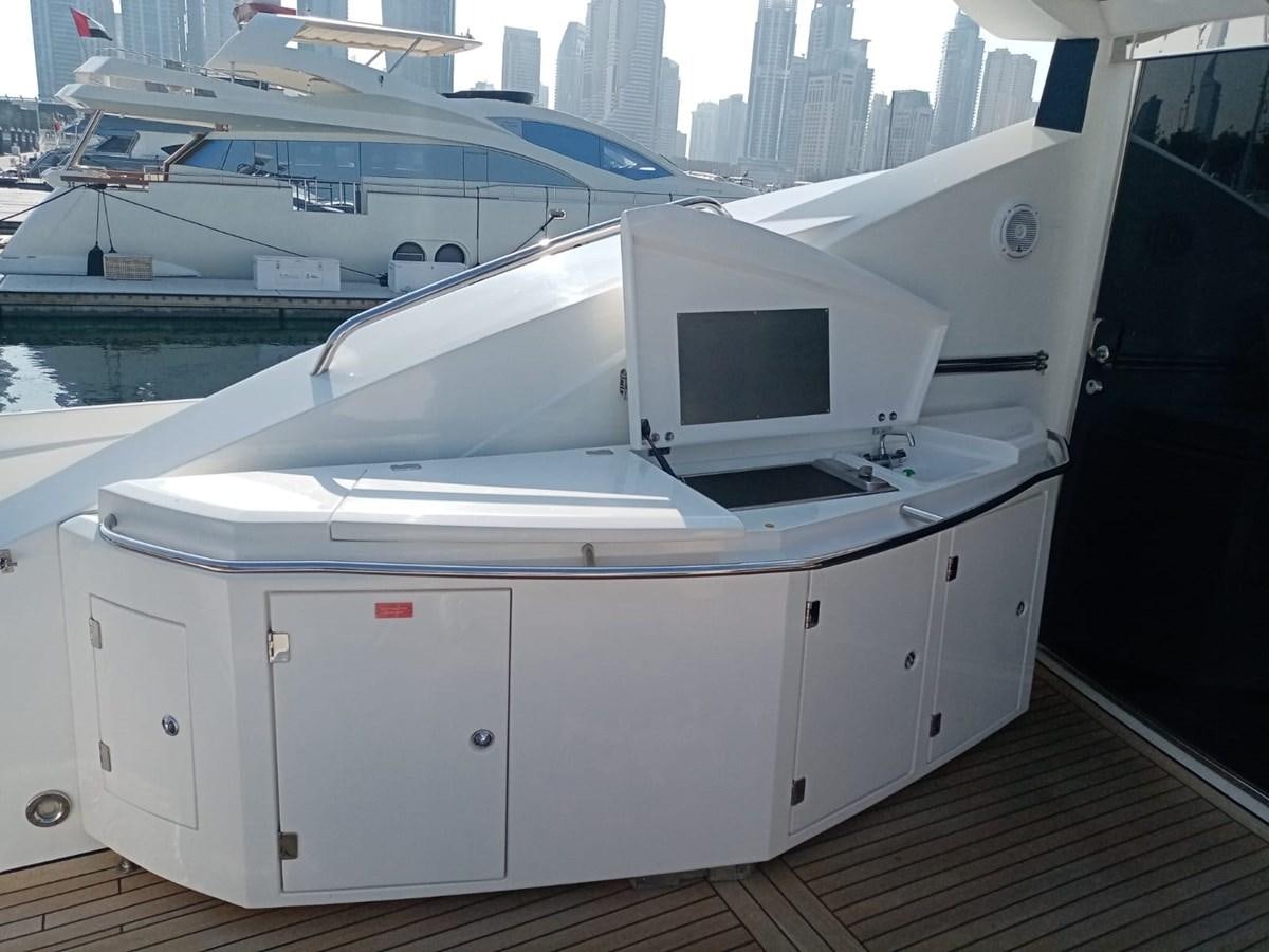 a boat on a deck aboard MILA DUBAI Yacht for Sale