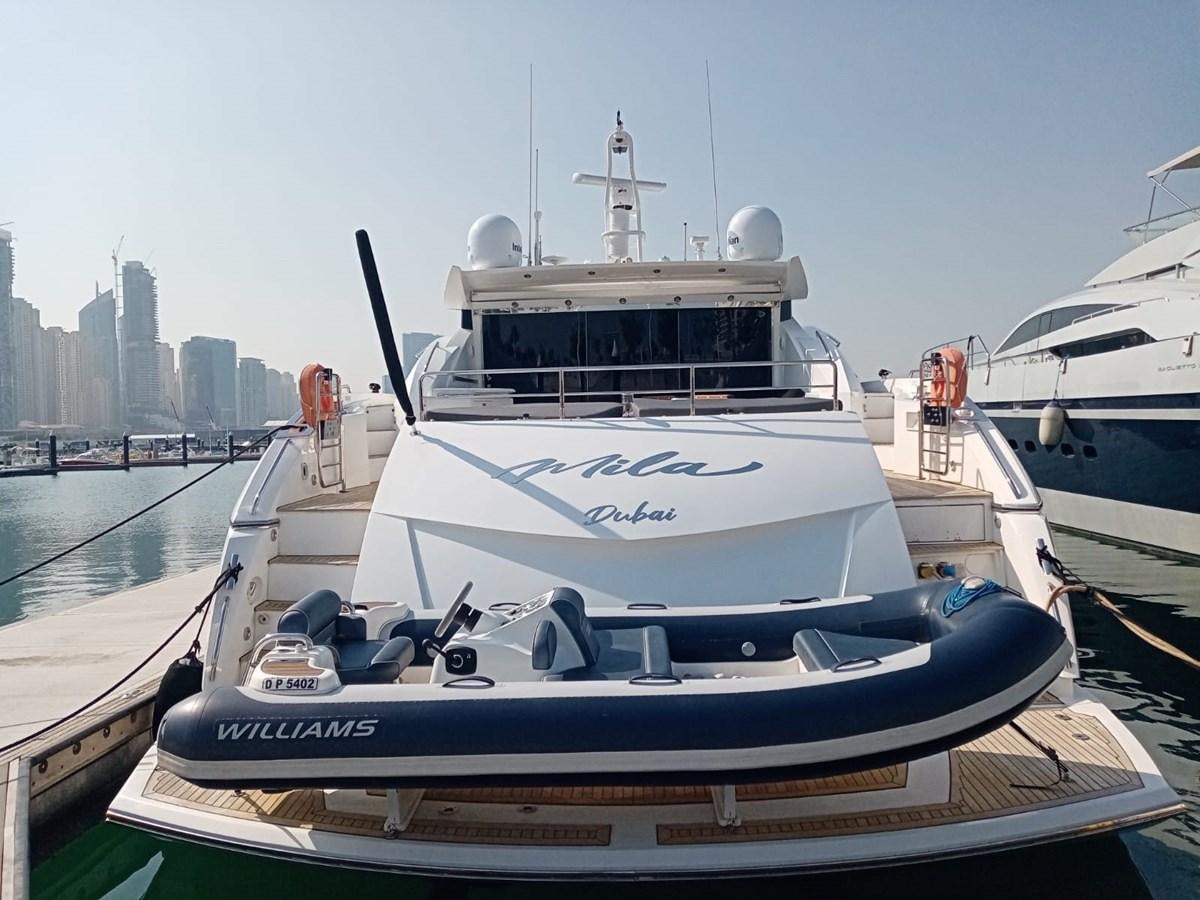 a boat docked at a pier aboard MILA DUBAI Yacht for Sale