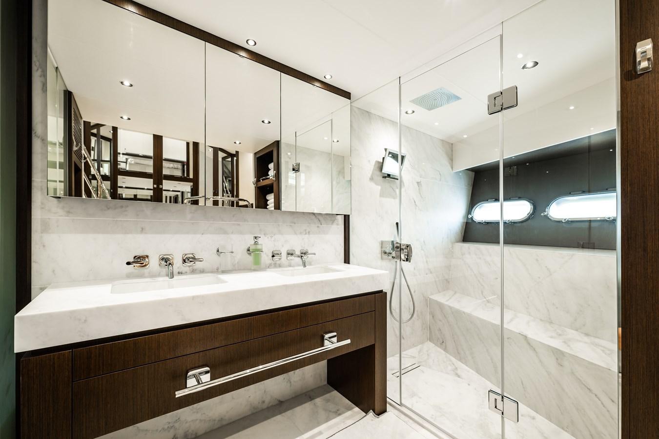 a bathroom with a large mirror aboard MANDALA Yacht for Sale