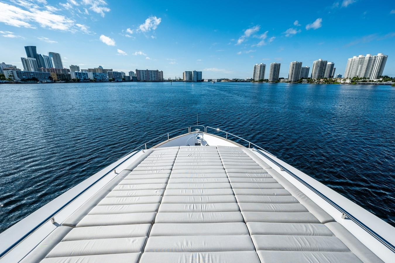 a dock leading to a city aboard MANDALA Yacht for Sale