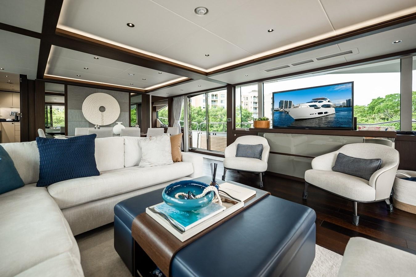 a living room with a large window aboard MANDALA Yacht for Sale