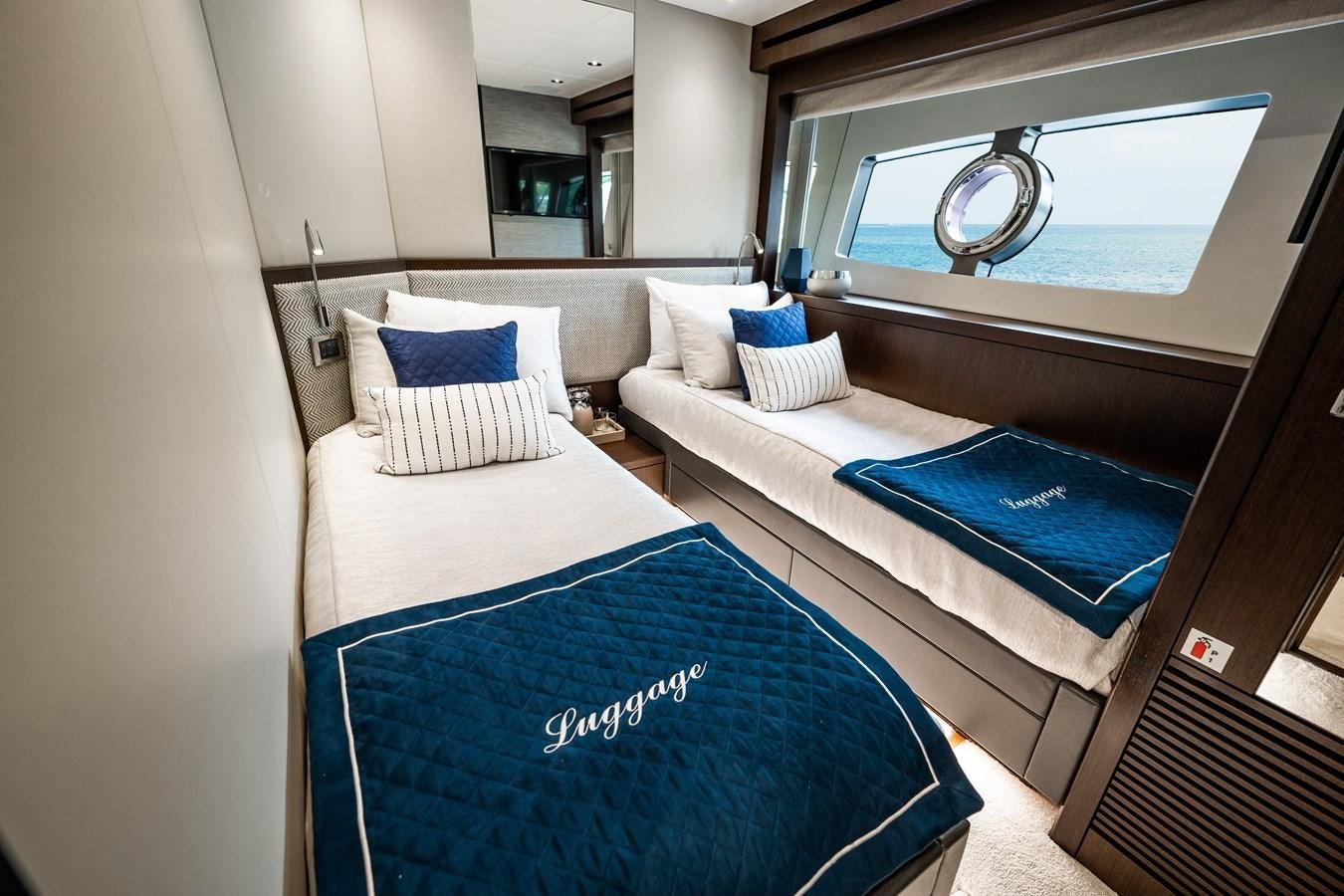 a room with a bed and a couch aboard MANDALA Yacht for Sale