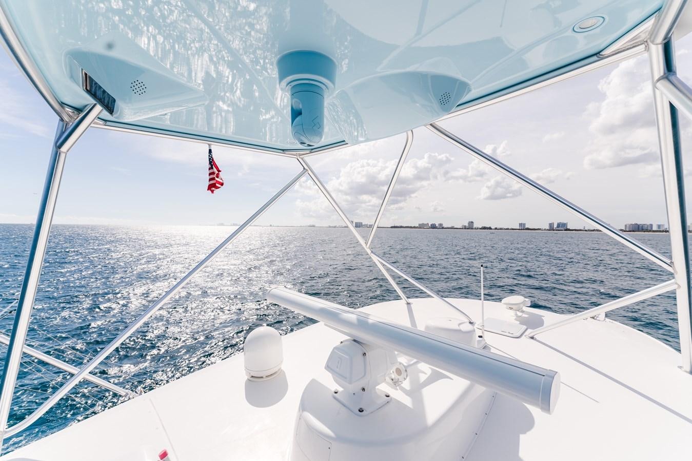 a boat with a flag on the front aboard PANACEA Yacht for Sale