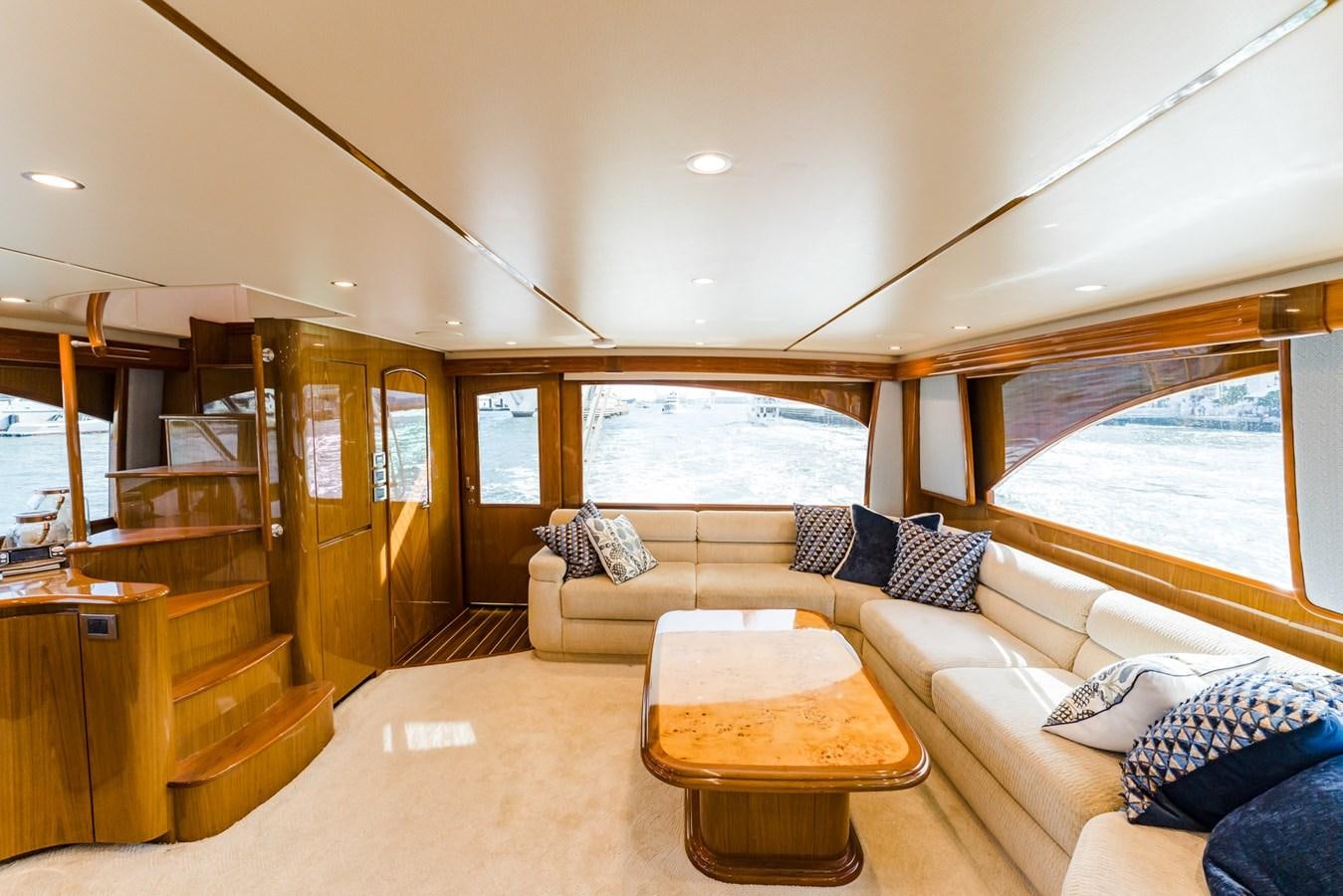 a living room with a couch and a table aboard PANACEA Yacht for Sale