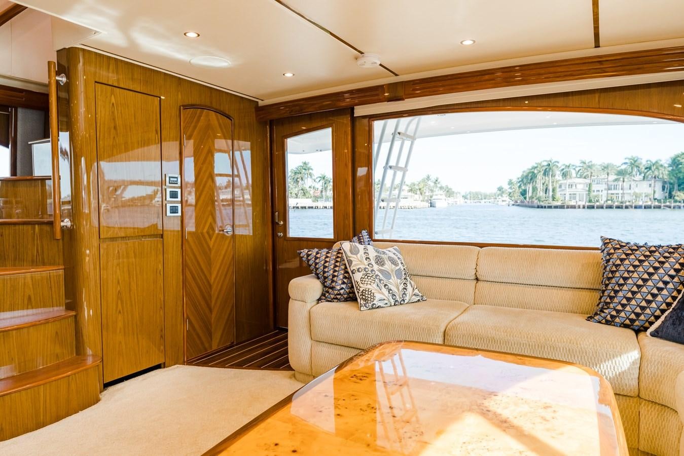 a living room with a couch and a table aboard PANACEA Yacht for Sale