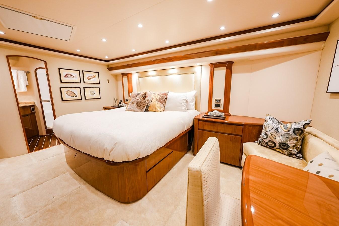 a room with a bed and a table aboard PANACEA Yacht for Sale