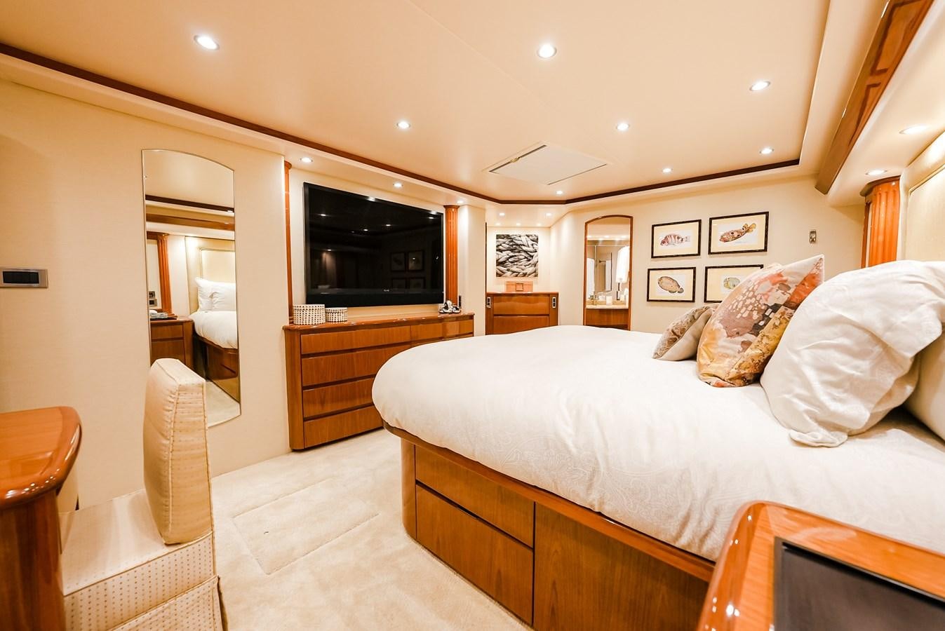 a bedroom with a bed and a television aboard PANACEA Yacht for Sale