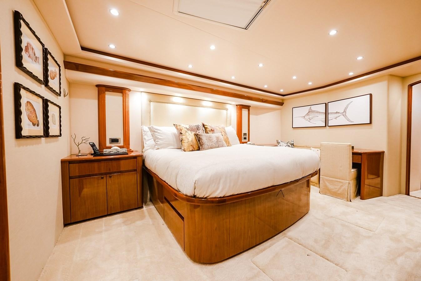 a bedroom with a bed and a dresser aboard PANACEA Yacht for Sale
