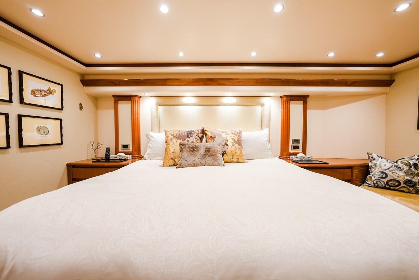 a bed with white sheets aboard PANACEA Yacht for Sale