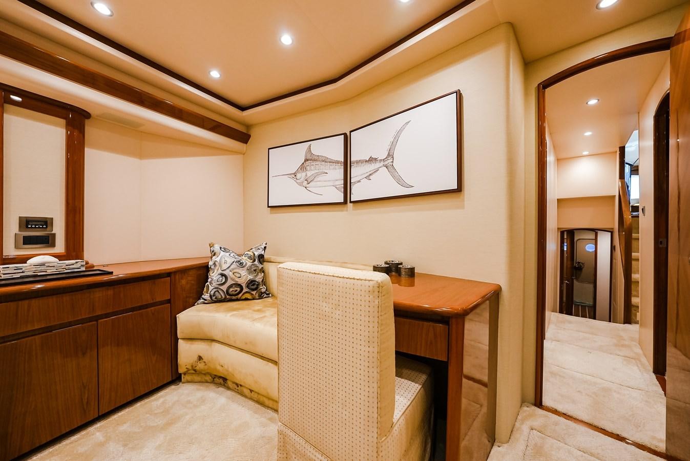a living room with a couch and a mirror aboard PANACEA Yacht for Sale