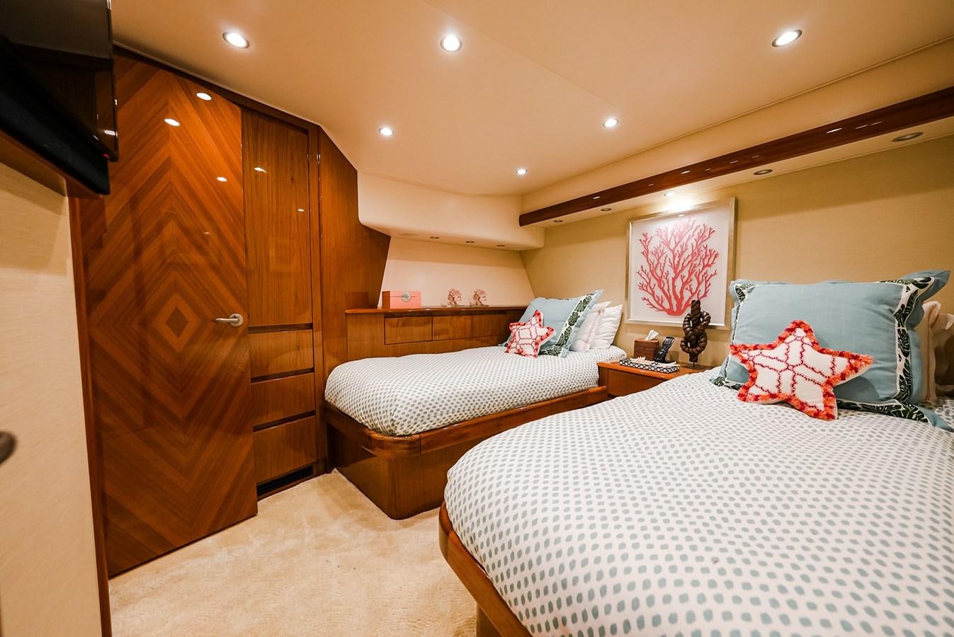 a bedroom with a couple of beds aboard PANACEA Yacht for Sale