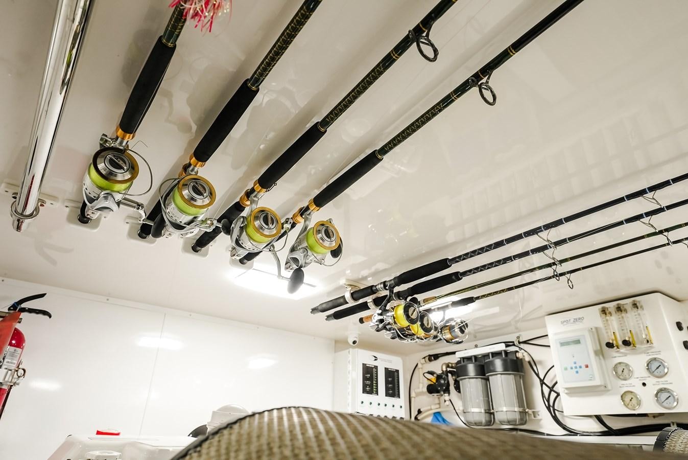 a white wall with a wire and a white wall with a black and white object on it aboard PANACEA Yacht for Sale