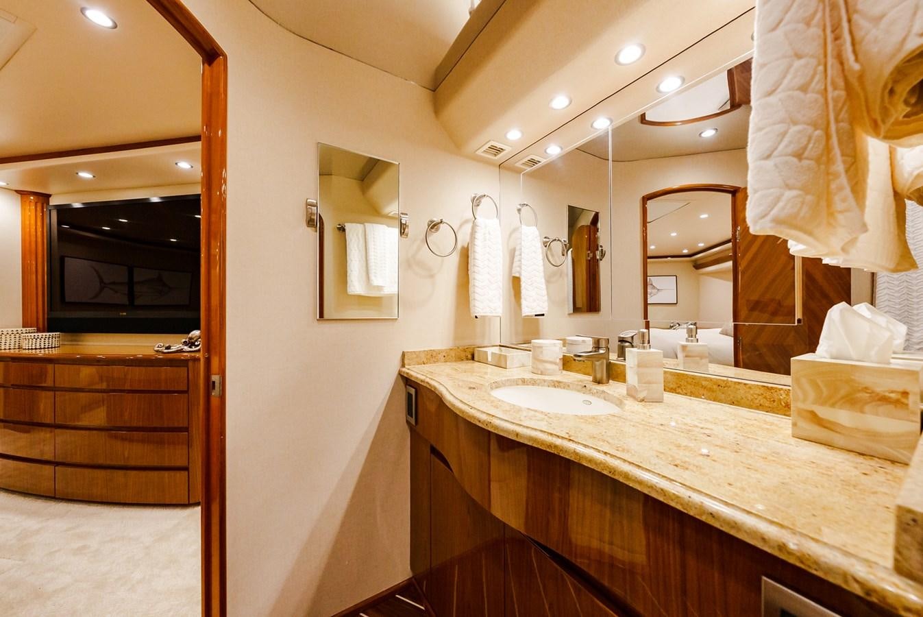 a bathroom with a countertop sink and mirrors aboard PANACEA Yacht for Sale