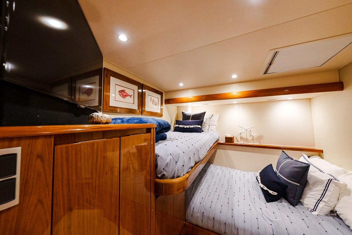 a bedroom with two beds aboard PANACEA Yacht for Sale