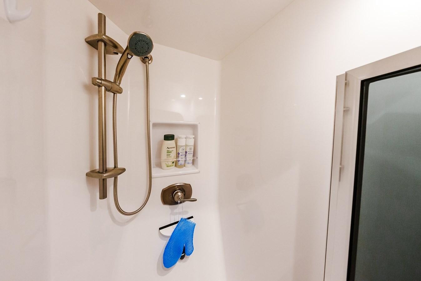 a bathroom with a shower head aboard PANACEA Yacht for Sale