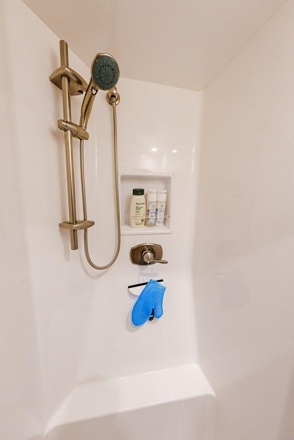 a bathroom with a shower head aboard PANACEA Yacht for Sale