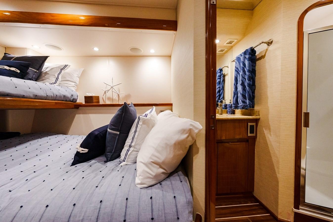 a bedroom with a bed and a closet aboard PANACEA Yacht for Sale