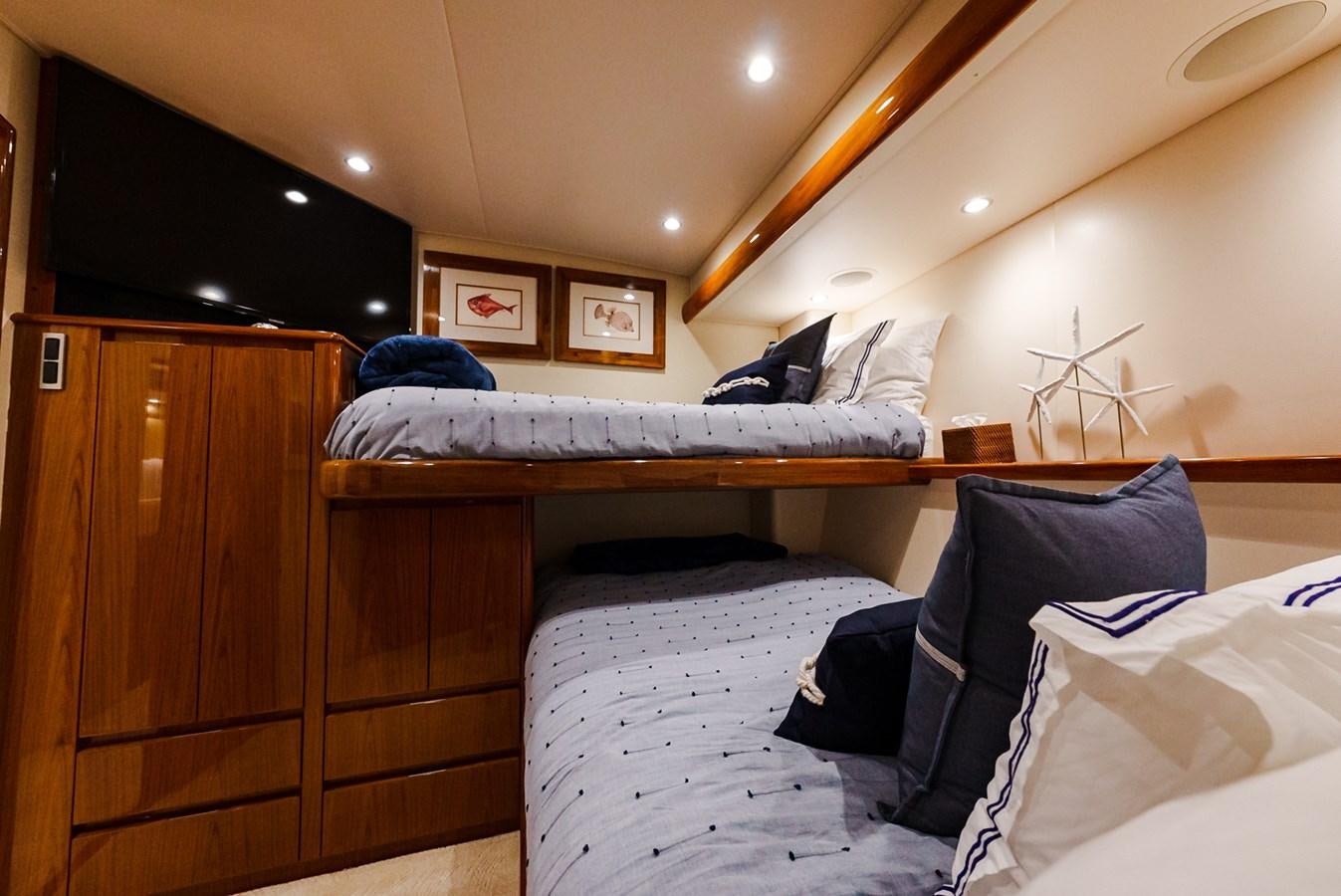 a bedroom with a couple of beds aboard PANACEA Yacht for Sale
