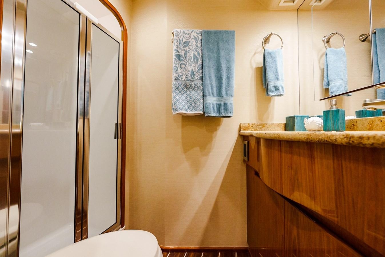 a bathroom with a shower and a sink aboard PANACEA Yacht for Sale