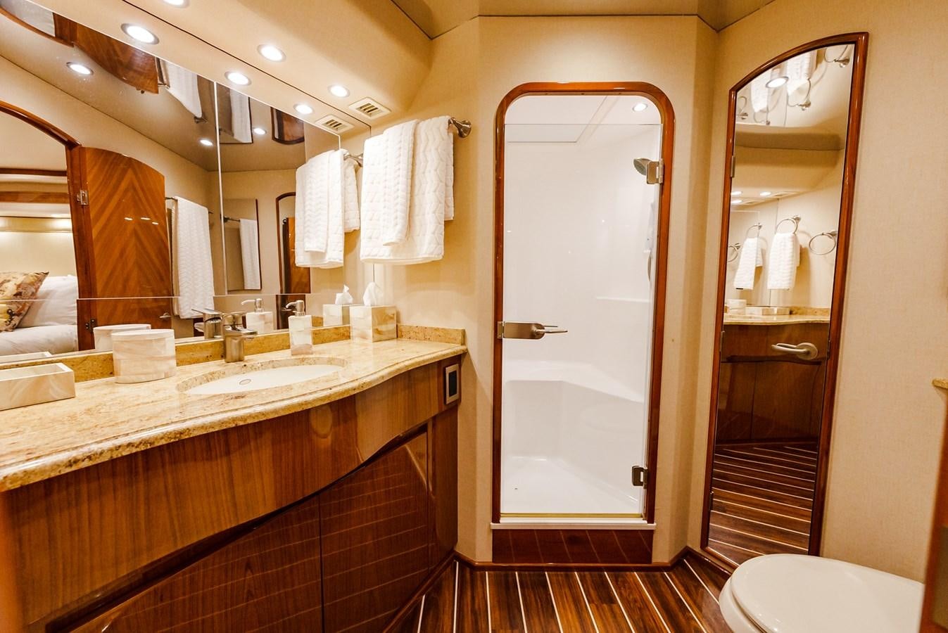 a bathroom with a large mirror aboard PANACEA Yacht for Sale