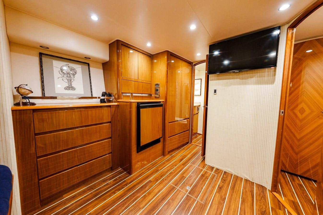 a room with wooden cabinets and a wood floor aboard PANACEA Yacht for Sale