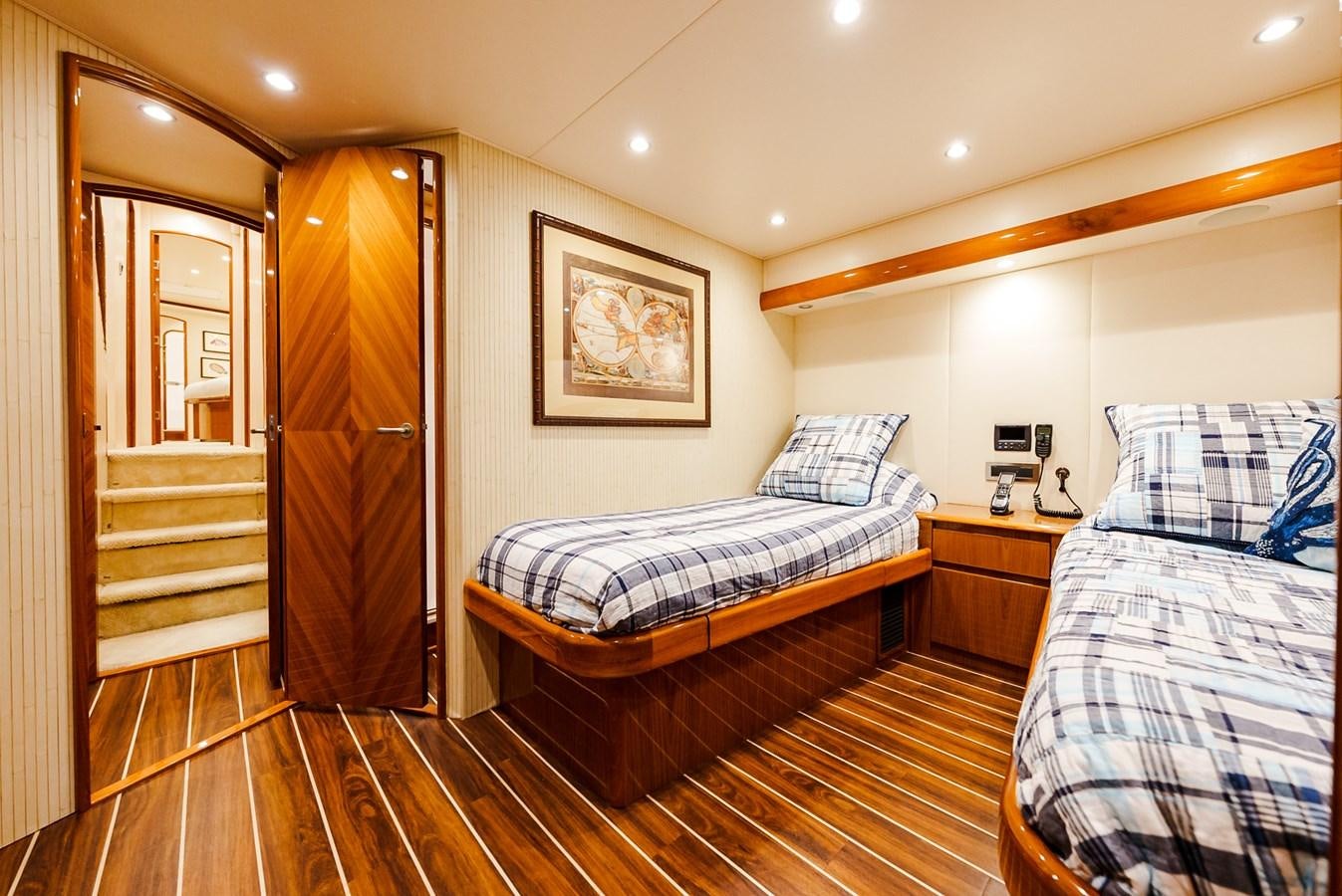 a bedroom with a bed and a door aboard PANACEA Yacht for Sale