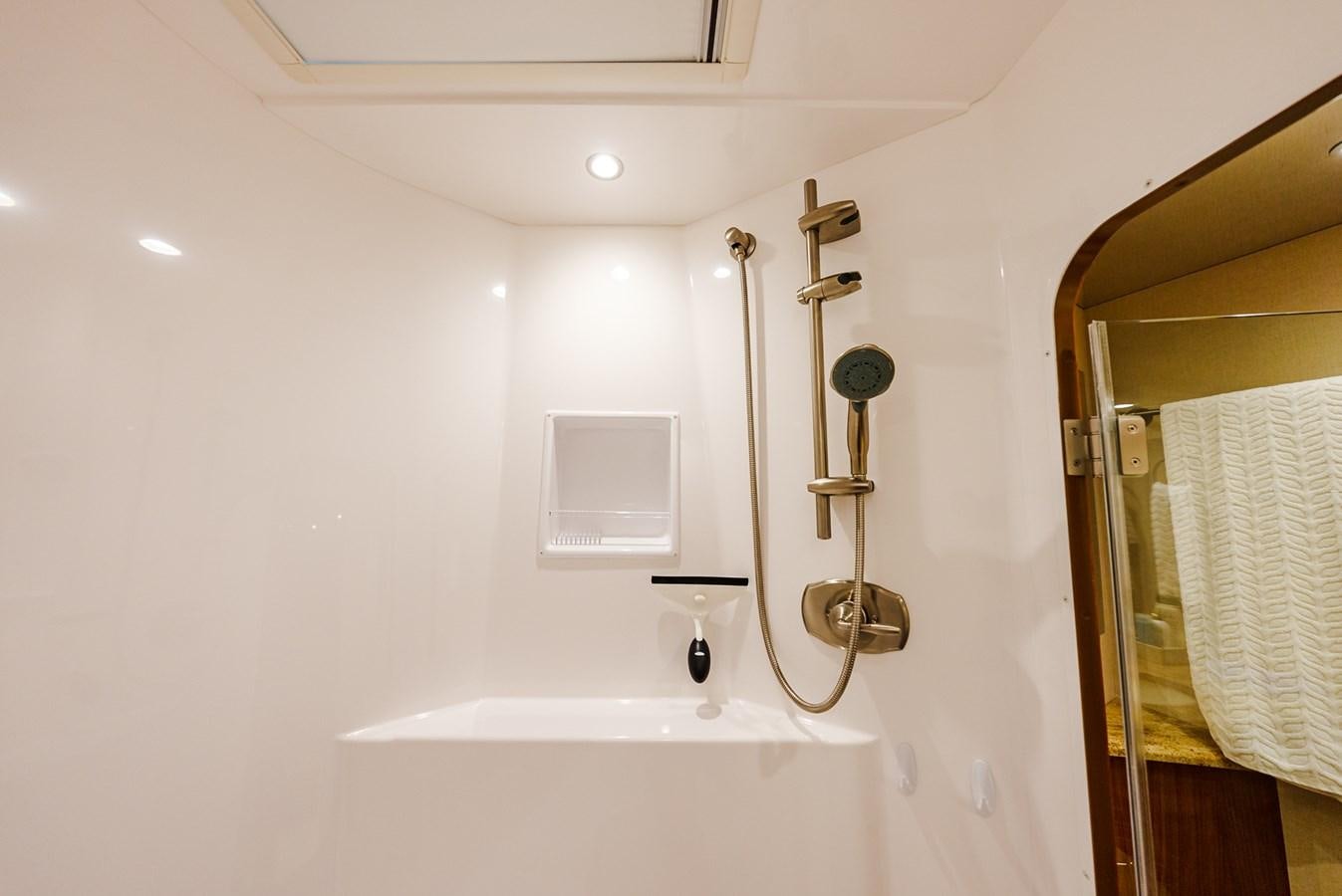 a bathroom with a bathtub and shower aboard PANACEA Yacht for Sale