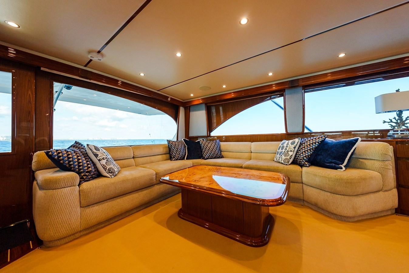 a living room with a couch and a table aboard PANACEA Yacht for Sale