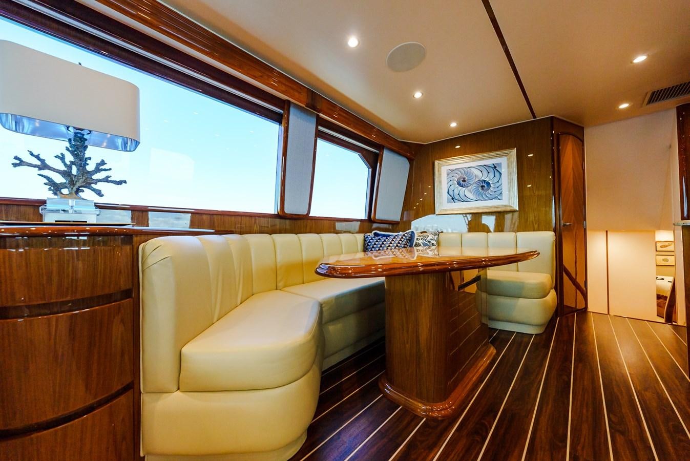 a room with a table and chairs aboard PANACEA Yacht for Sale