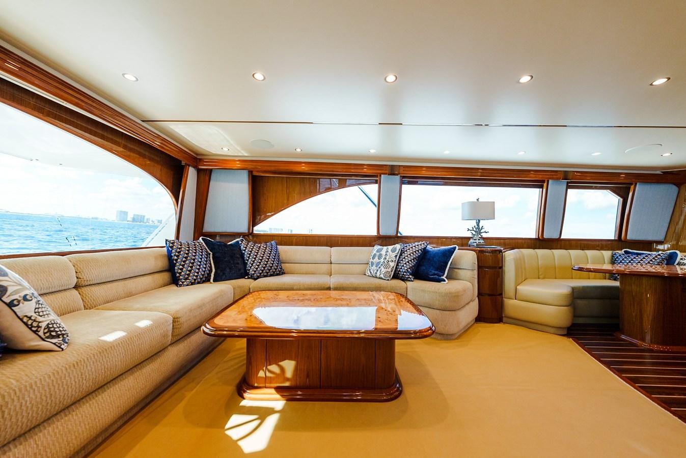 a living room with a couch and a table aboard PANACEA Yacht for Sale