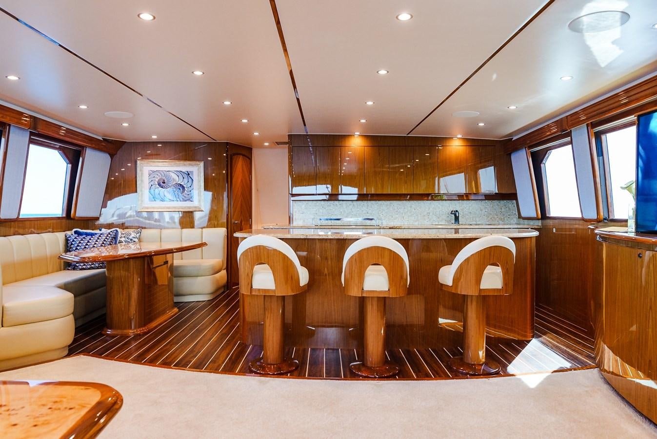 a large kitchen with a table and chairs aboard PANACEA Yacht for Sale
