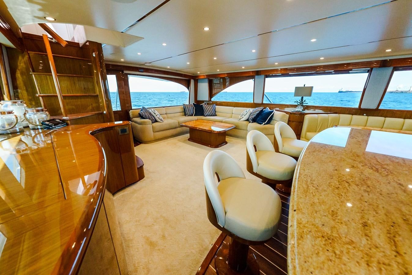 a room with a couch and chairs aboard PANACEA Yacht for Sale