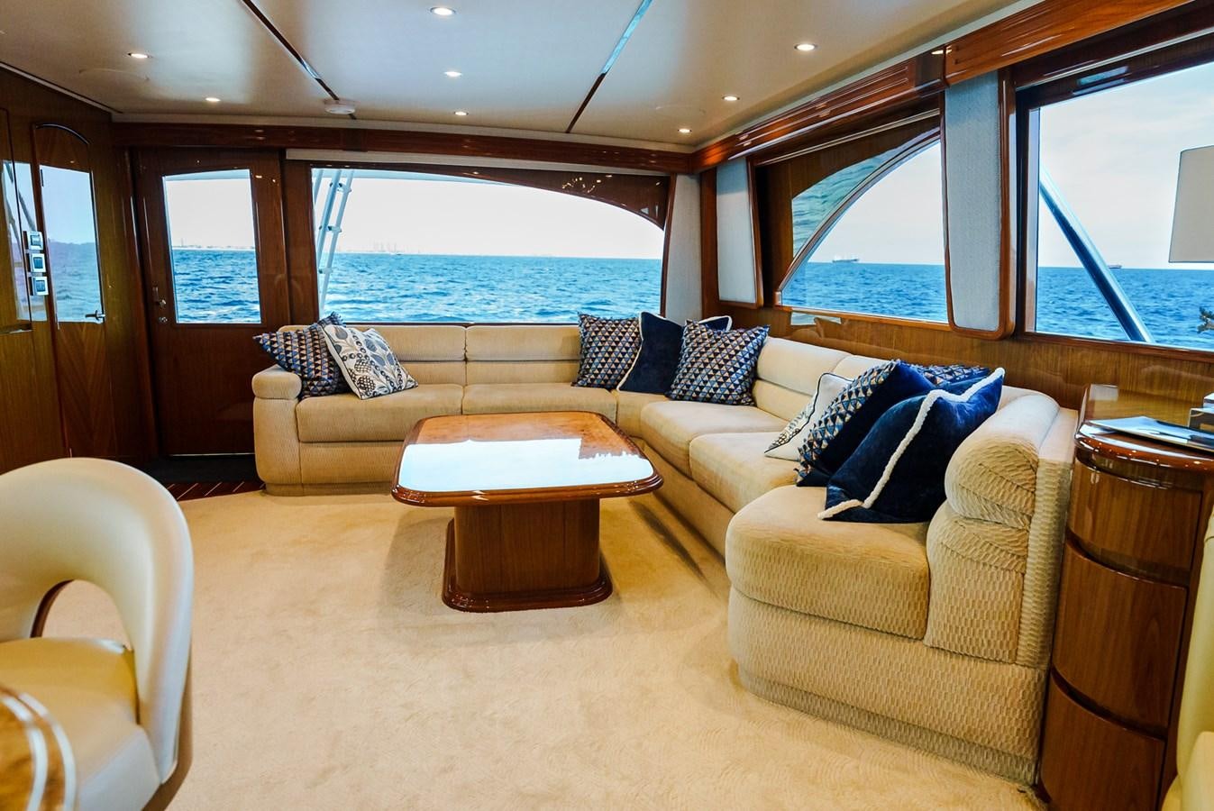 a living room with a large window aboard PANACEA Yacht for Sale