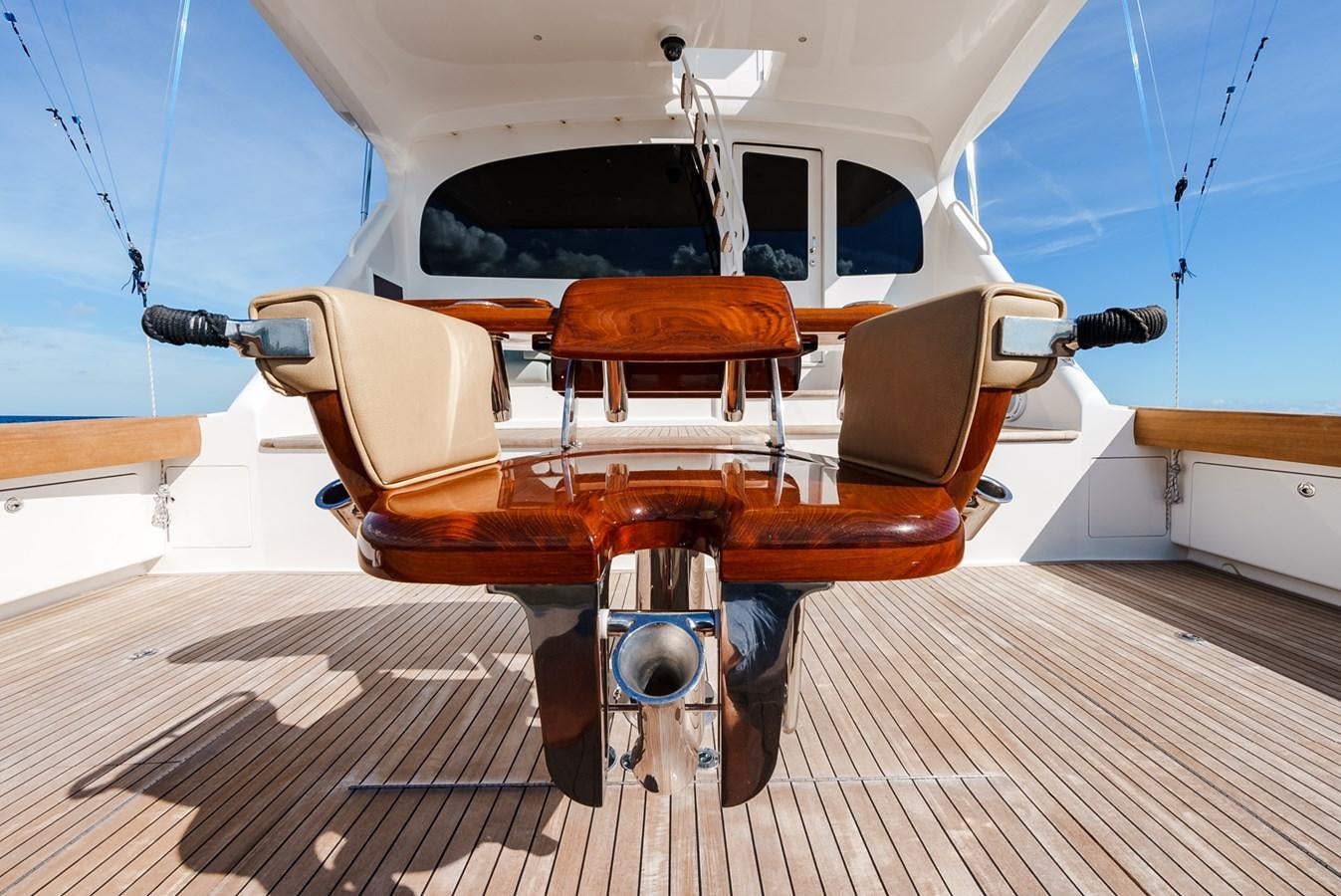 a white and orange boat on a wooden dock aboard PANACEA Yacht for Sale