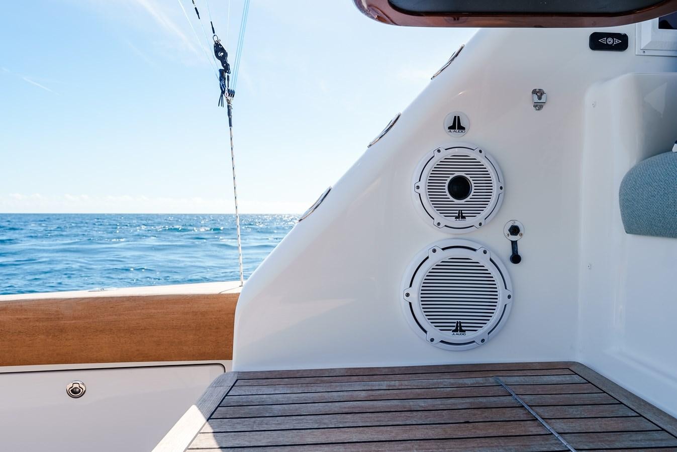 a white boat on a body of water aboard PANACEA Yacht for Sale